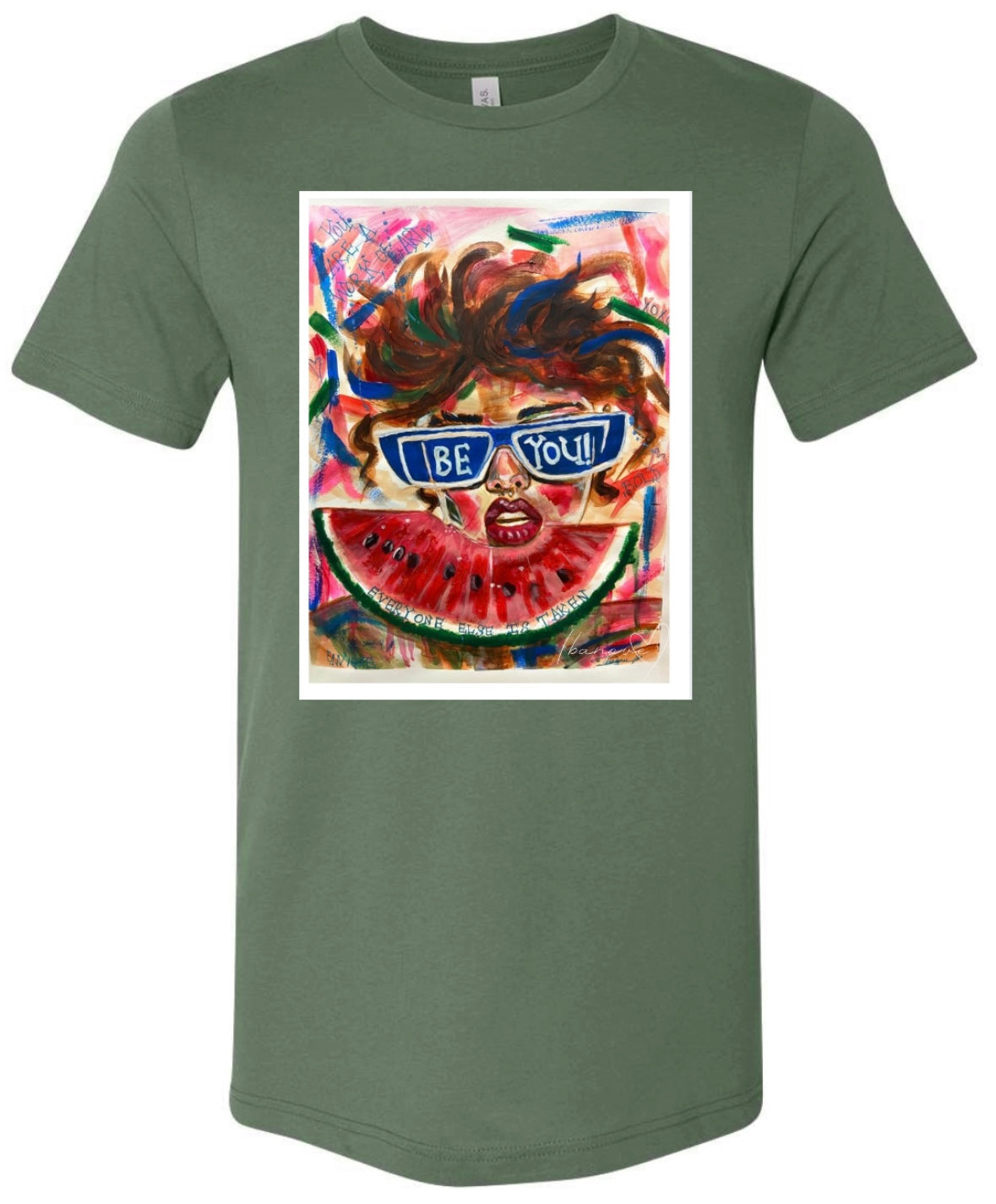 Be Bold green t-shirt featuring woman with sunglasses and wild hair on colorful background with watermelon fruit in front of her and text on background "you're a work of art" - front view