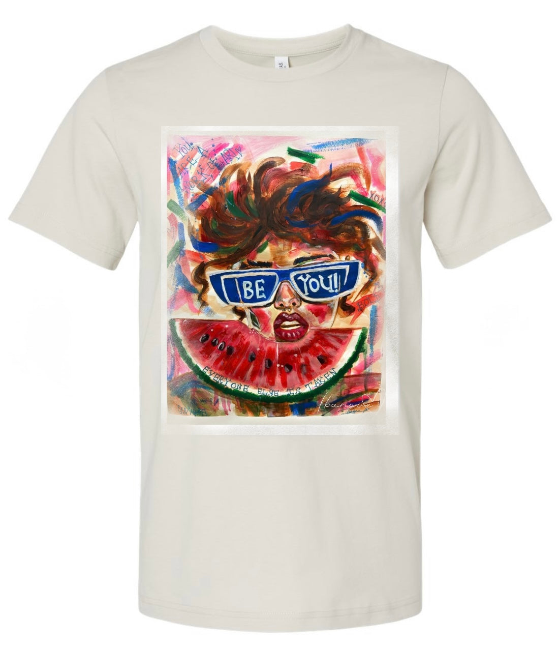 Be Bold beige t-shirt featuring woman with sunglasses and wild hair on colorful background with watermelon fruit in front of her and text on background "you're a work of art" - front view

