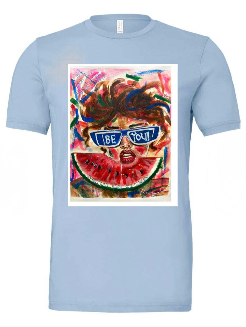 Be Bold blue t-shirt featuring woman with sunglasses and wild hair on colorful background with watermelon fruit in front of her and text on background "you're a work of art" - front view
